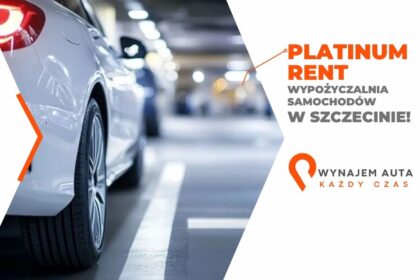 Biały samochód w garażu z reklamą wynajem aut w Szczecinie.
